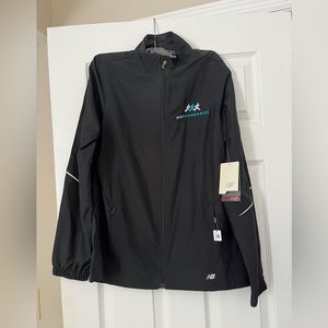 Brand new with tags womens New Balance light weight jacket with back vent.